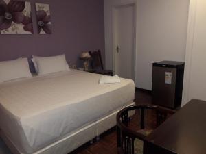 Giường trong phòng chung tại Hotel Casa Jardin