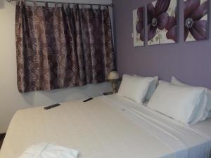 Giường trong phòng chung tại Hotel Casa Jardin