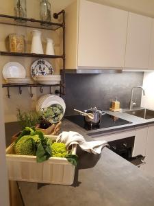 a kitchen with a tray of vegetables on a counter at Ihr neuer Lieblingsplatz in Meran in Merano