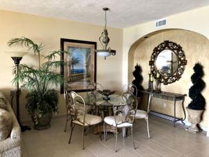 a dining room with a table and chairs and a mirror at Sonoran Sea 3BR Deluxe SSE 608 by Casago in Puerto Pe&ntilde;asco