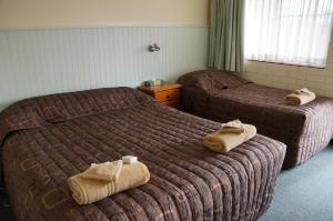 Postel nebo postele na pokoji v ubytování Green Gables Motel