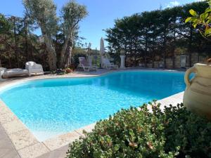 Bazén v ubytovaní B&B Villa del Sole Relais alebo v jeho blízkosti