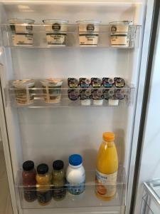 an open refrigerator filled with lots of food and drinks at Bari Lory’s Home in Bari