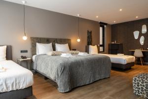 מיטה או מיטות בחדר ב-Boutique Suites Lisse - Schiphol