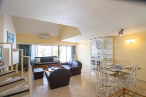 a living room with a couch and a table at Capitalmoura Mouragolf Village in Vilamoura