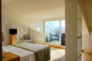 Cama ou camas em um quarto em Hotel Laranjeira