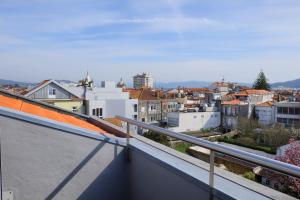 a view of a city from a balcony at Hotel Laranjeira in Viana do Castelo