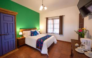 Postel nebo postele na pokoji v ubytování Hotel Camino Antiguo