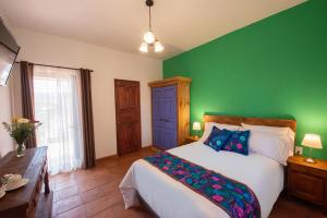 Postel nebo postele na pokoji v ubytování Hotel Camino Antiguo
