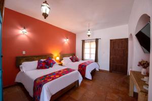 Postel nebo postele na pokoji v ubytování Hotel Camino Antiguo