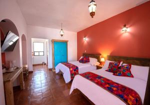 Postel nebo postele na pokoji v ubytování Hotel Camino Antiguo