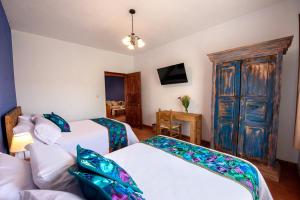 Postel nebo postele na pokoji v ubytování Hotel Camino Antiguo