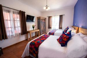 Postel nebo postele na pokoji v ubytování Hotel Camino Antiguo