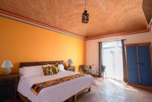 Postel nebo postele na pokoji v ubytování Hotel Camino Antiguo