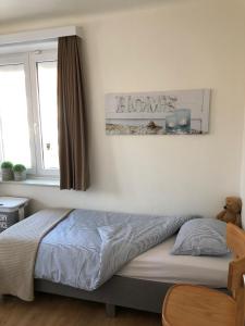 
A bed or beds in a room at Knokke Boudewijnlaan
