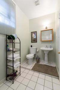 a bathroom with a toilet and a sink at 1549 North Maplewood Avenue in Chicago