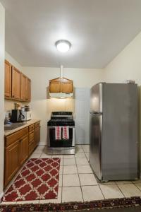 a kitchen with a stainless steel refrigerator at 1549 North Maplewood Avenue in Chicago