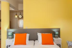 Postel nebo postele na pokoji v ubytování Evelia Apartment