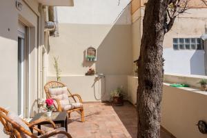 Patio nebo venkovní prostory v ubytování Evelia Apartment