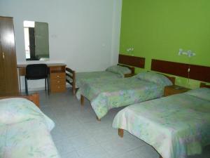 Cama o camas de una habitación en HOTEL 25 DE MAYO