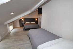 Ліжко або ліжка в номері Promenade Hotel