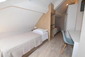 Ліжко або ліжка в номері Promenade Hotel