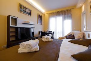 two towels on two beds in a living room at Jolie in Belgrade