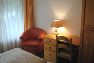 Postel nebo postele na pokoji v ubytování Chalet-Hotel Beau-Site