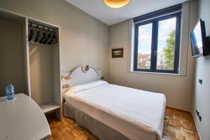 Un pat sau paturi într-o cameră la Sotopalacio HSR