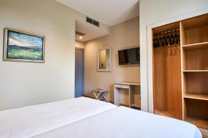 A bed or beds in a room at Sotopalacio HSR
