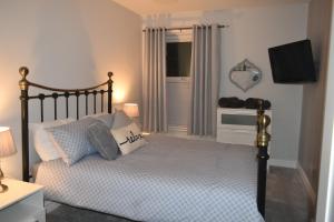 Кровать или кровати в номере Pleasure Beach House