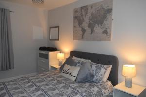 Кровать или кровати в номере Pleasure Beach House