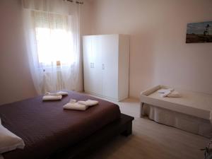 Posteľ alebo postele v izbe v ubytovaní B&B Stella Di Mare