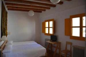 Giường trong phòng chung tại Posada Hoyos de Iregua