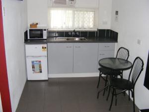 Kuchyň nebo kuchyňský kout v ubytování Motel Lodge