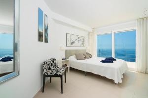 A bed or beds in a room at Villa Bombon