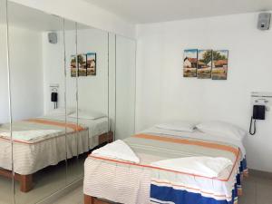 Ένα ή περισσότερα κρεβάτια σε δωμάτιο στο Hostal Sueños