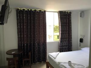 Ένα ή περισσότερα κρεβάτια σε δωμάτιο στο Hostal Sueños