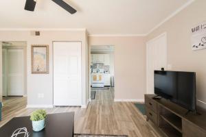 a living room with a flat screen tv at Cute Condo in Rock Hill-45 in Rock Hill