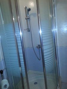 a shower in a bathroom with a glass shower stall at Center Medina in Fès