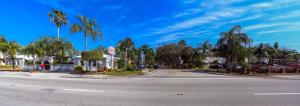 an empty street with palm trees on the side of the road at Richard's Motel in Hollywood