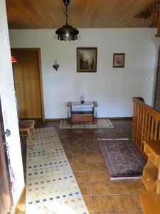 a living room with a bench and a table at Ferienhaus Luhetalblick Prescher in Bispingen