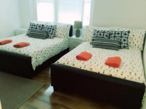 two beds sitting next to each other in a bedroom at 96 Rochester Street in Chatham