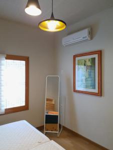 Postel nebo postele na pokoji v ubytování Tong Stay