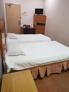 Postel nebo postele na pokoji v ubytování New City Hotel