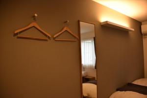 A bed or beds in a room at Shiretokoserai