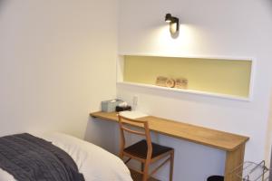 A bed or beds in a room at Shiretokoserai