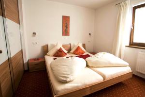 Ein Bett oder Betten in einem Zimmer der Unterkunft Alpen Apartments Austria