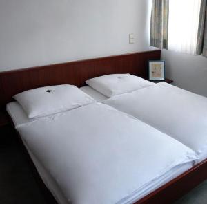 Postel nebo postele na pokoji v ubytování Hotel Filoxenia