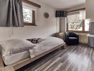 Postel nebo postele na pokoji v ubytování Hotel Marmotte